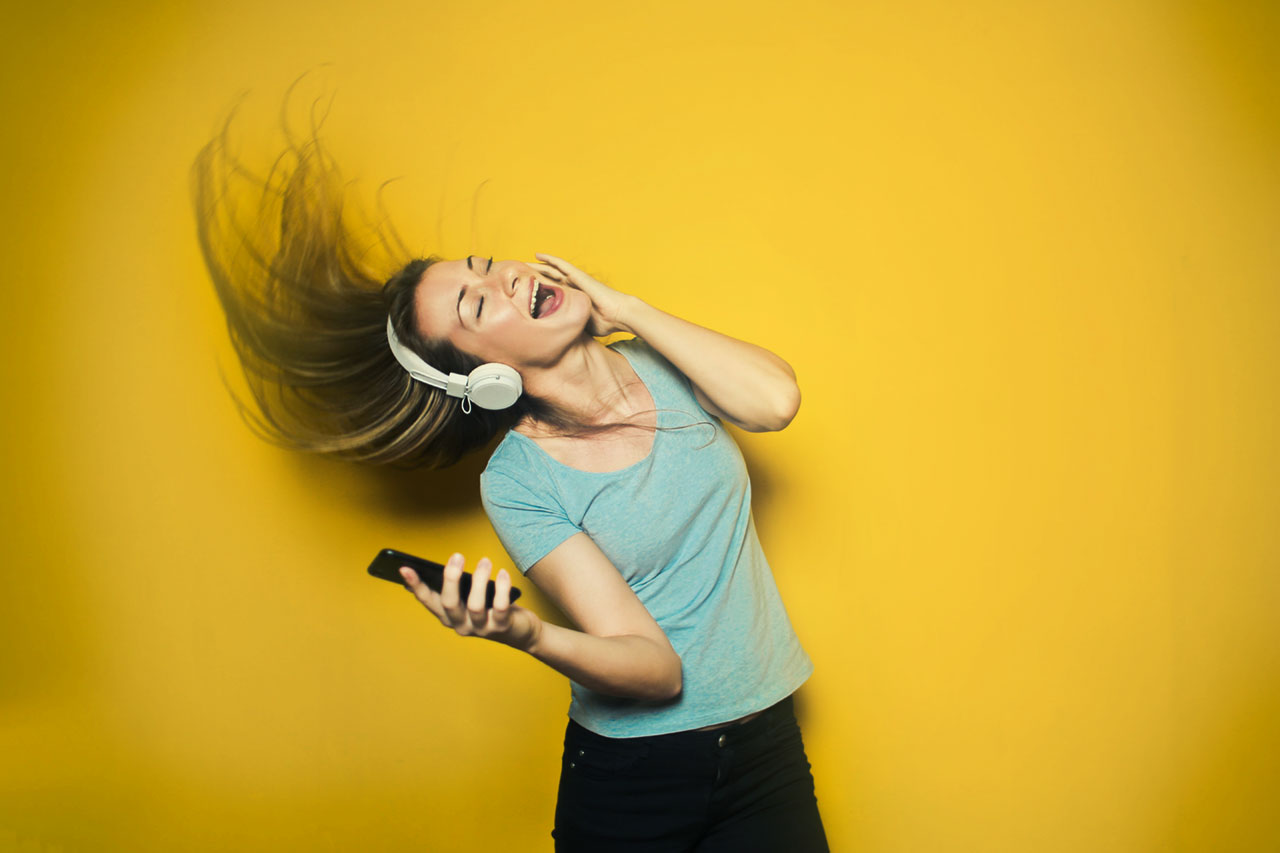 Girl listening to music on Android